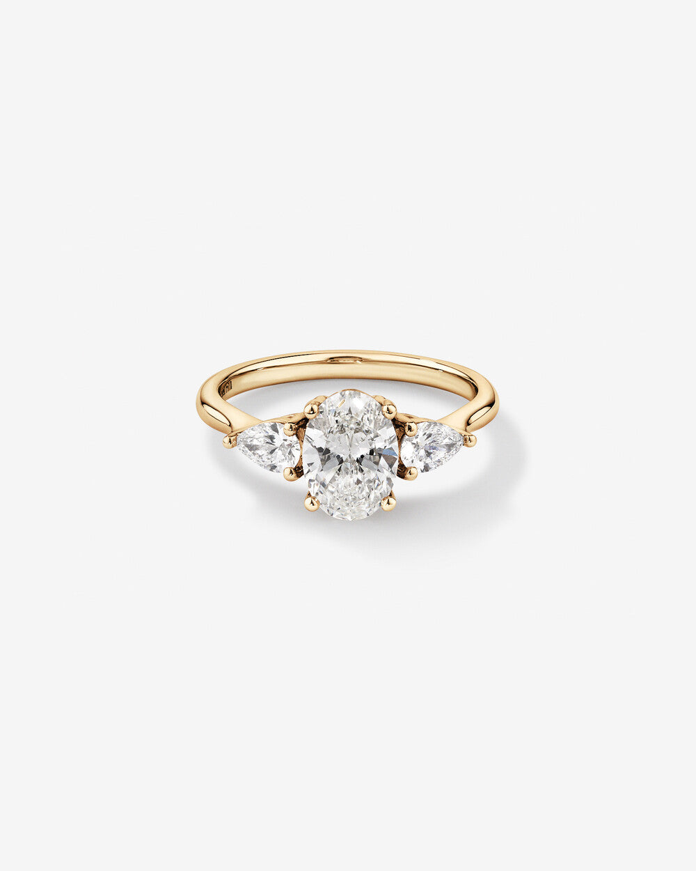 Oval Diamond Ring with Pear Side Stones in Yellow Gold