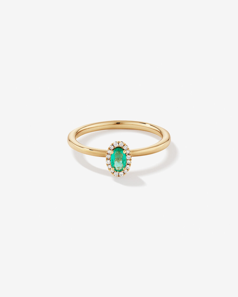 Oval Emerald Halo Ring in Yellow Gold