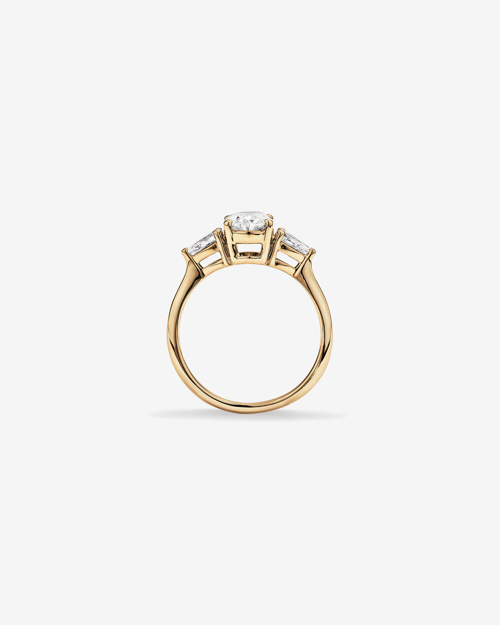 Oval Diamond Ring with Pear Side Stones in Yellow Gold