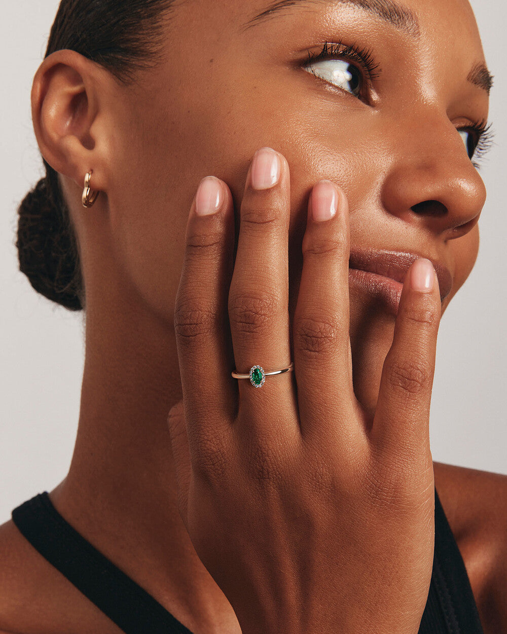 Oval Emerald Halo Ring in Yellow Gold