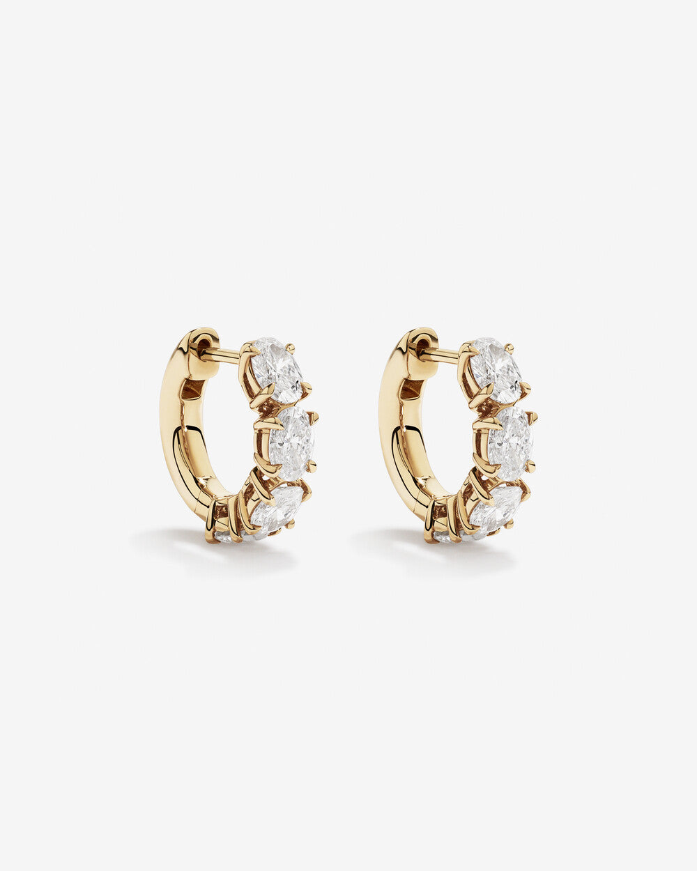 Luxe Oval Brilliance Diamond Huggie Earrings in Yellow Gold