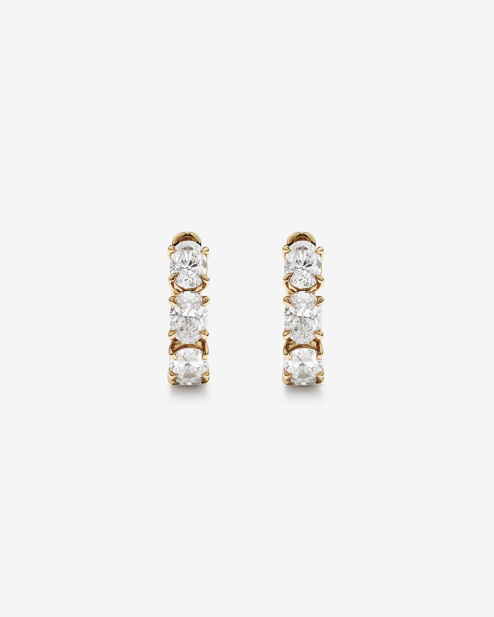 Luxe Oval Brilliance Diamond Huggie Earrings in Yellow Gold