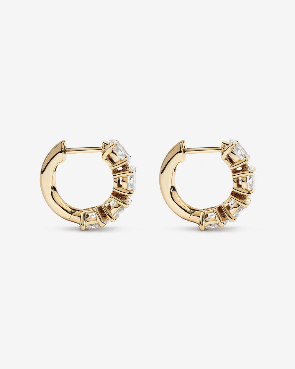 Luxe Oval Brilliance Diamond Huggie Earrings in Yellow Gold